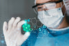 Medical professional examining best disposable face masks in Australia with futuristic health icons