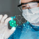 Medical professional examining best disposable face masks in Australia with futuristic health icons
