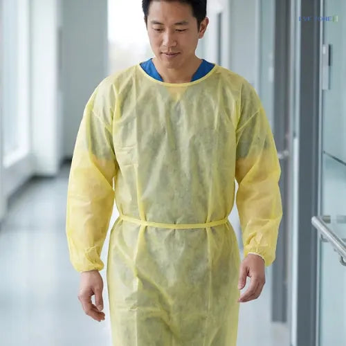 Disposable yellow medical gown for infection control single use protective apparel in healthcare settings