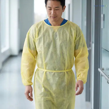 Disposable yellow medical gown for infection control single use protective apparel in healthcare settings
