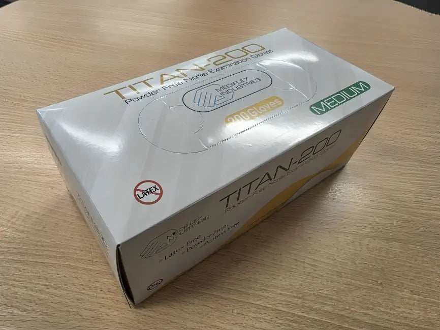 Titan medium powder free nitrile gloves box with 200 gloves on wooden surface